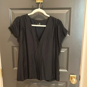 Black silk short sleeve top.  7 for All Mankind.  V neck size medium.